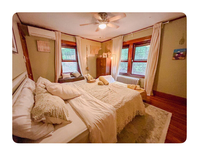 Bedroom #1 is decorated in a light green, comfortable decor. - 186 Linwood St