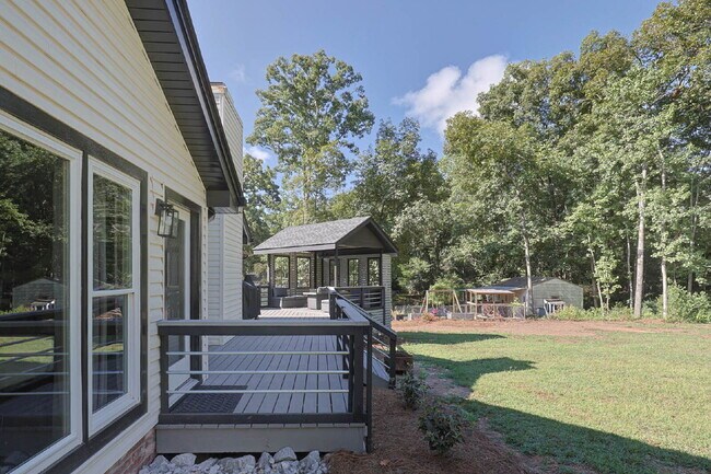 Building Photo - COMING SOON · Designer Renovation · Covered Deck Pavilion · 2-Car Garage · Lawn Care Included