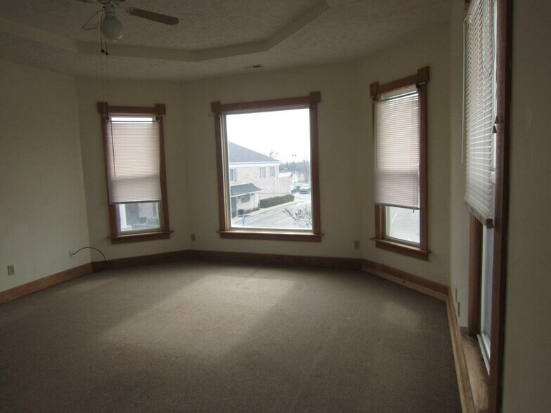 A older view of living room. Four windows make it well lit even on a dark day. - 1728 I St