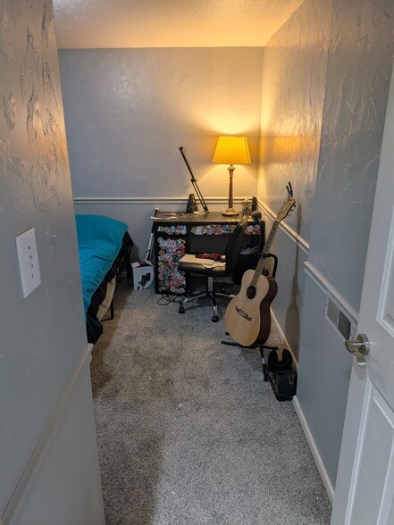 Bedroom one with stuff - 793 E Gables St