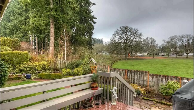 Building Photo - 4bd/3ba HUGE Home w/Hardwood Floors, Russian Fireplace, 2-Car Garage & Fenced Back Yard!