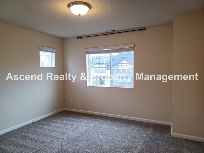 Building Photo - 3 Level End Unit Townhome with Newer Carpet, Open Floor Plan, 2 Balconies, 2 Car Attached Garage ...