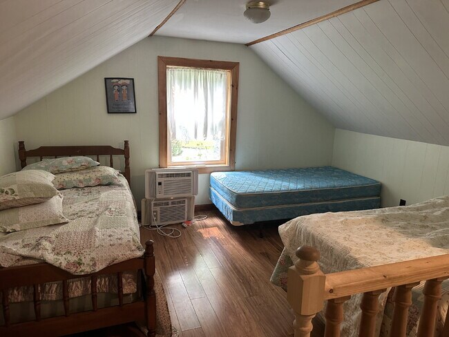 Building Photo - Charming 3BR Waterfront Retreat with Sunroom, Brick Accent & Scenic Lake Views