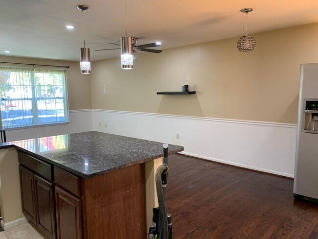 Living room with open kitchen island - 5625 Saint Charles Dr