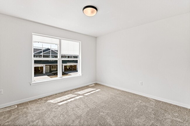 Building Photo - New 3 Bed Townhome with Covered Deck and Oversized Garage!