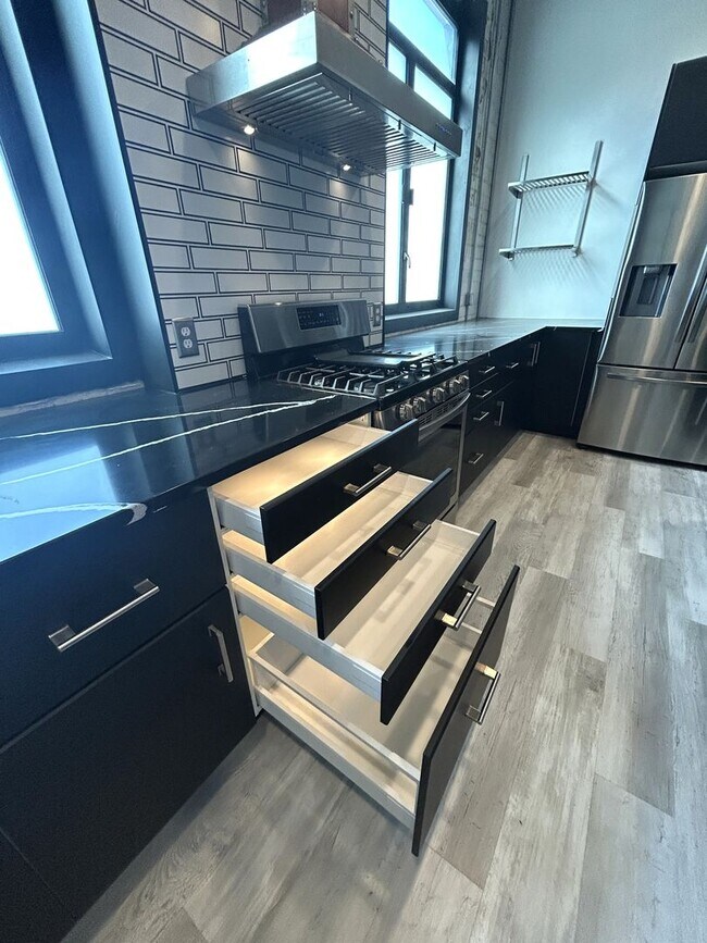 Building Photo - Industrial Style. Downtown Energy. Elevated Living.