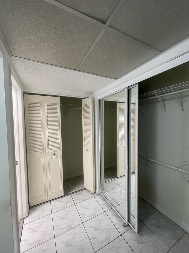 L-Shape Primary Suite Closet - 5100 SW 90th Ave