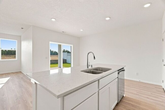 Building Photo - Modern 4-Bedroom Home with a 3-Car Garage & Covered Patio