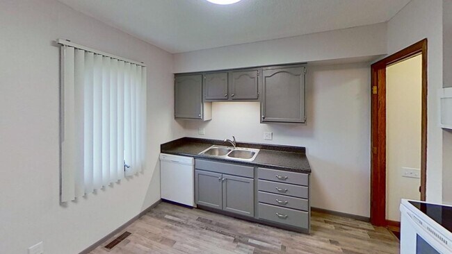 Building Photo - Updated 2BR/1BA duplex with office in partially finished basement, detached garage and across fro...