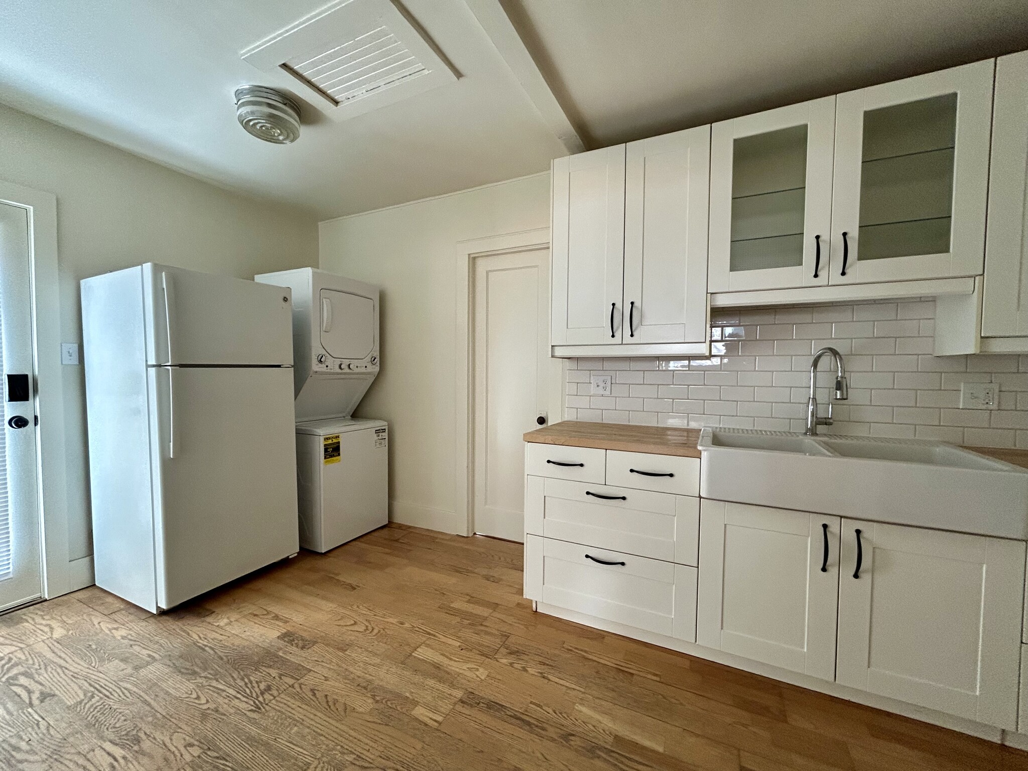 Kitchen, refrigerator and laundry. - 3442 1st St