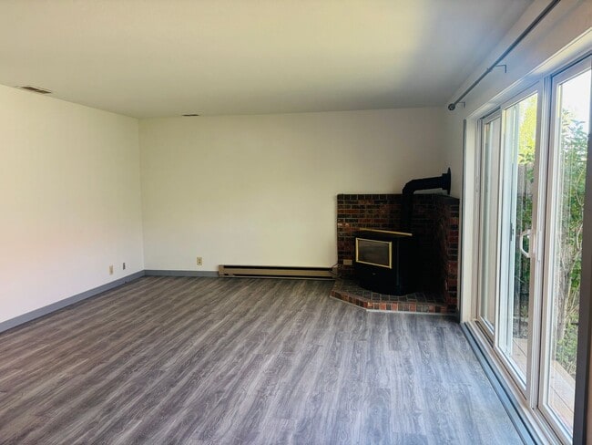 Building Photo - Renovated 3BR condo w/ garage & private yard **MOVE IN SPECIAL - $100 off each month**