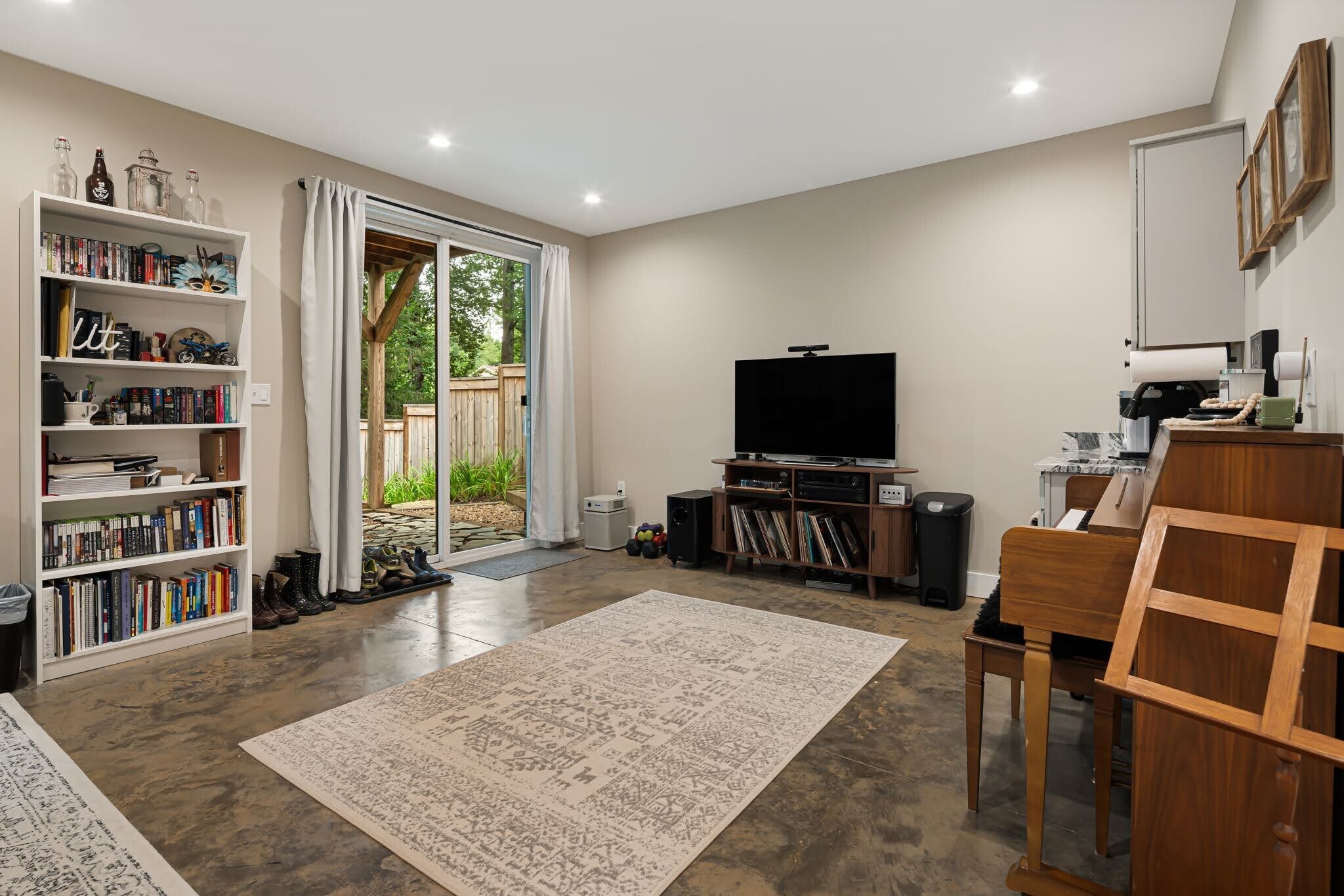 Lower-level studio entertainment and kitchenette area. - 33 Rex Dr