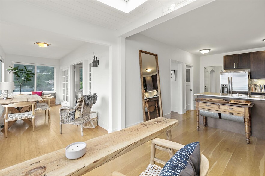 View from Eating Areaa to kitchen to sunroom - 306 3rd St