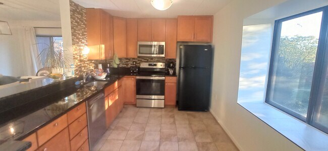 Kitchen is equipped with newer appliances - 100 Roberts Ln