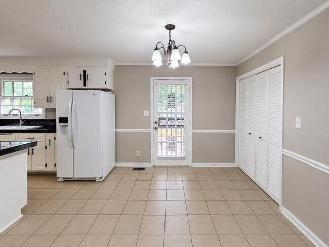 Building Photo - Welcome home to the perfect blend of peaceful country charm and modern city living!