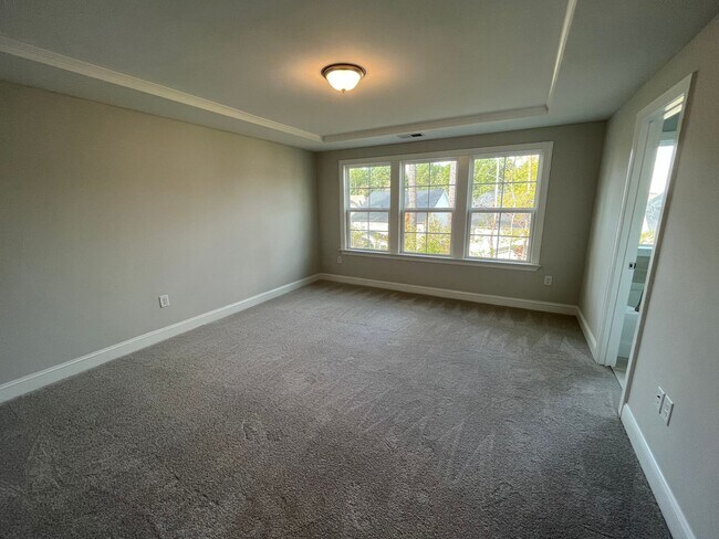 Building Photo - Newly Built 4BD, 3BA Cary Townhome with Modern Amenities and Screened-In Patio