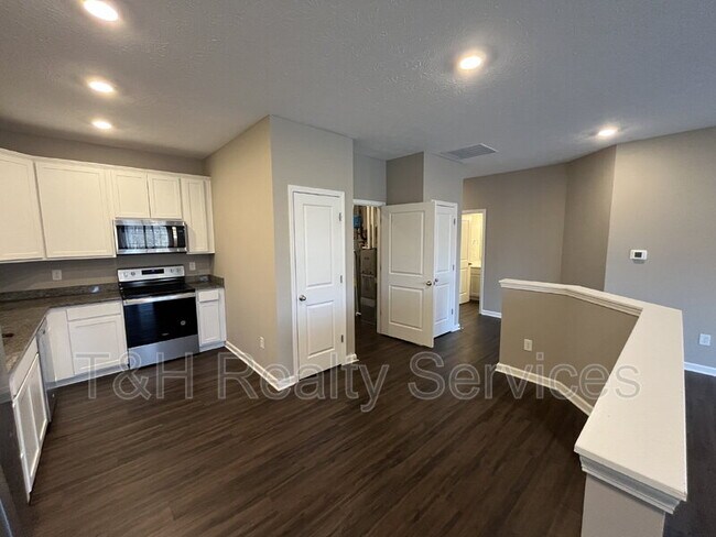 Building Photo - 5642 Brownstone Dr