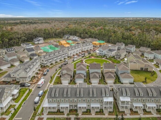 Building Photo - New Luxury Townhome in Celebration, FL Corner unit. All porcelain tiled floors. Aleutian model by...