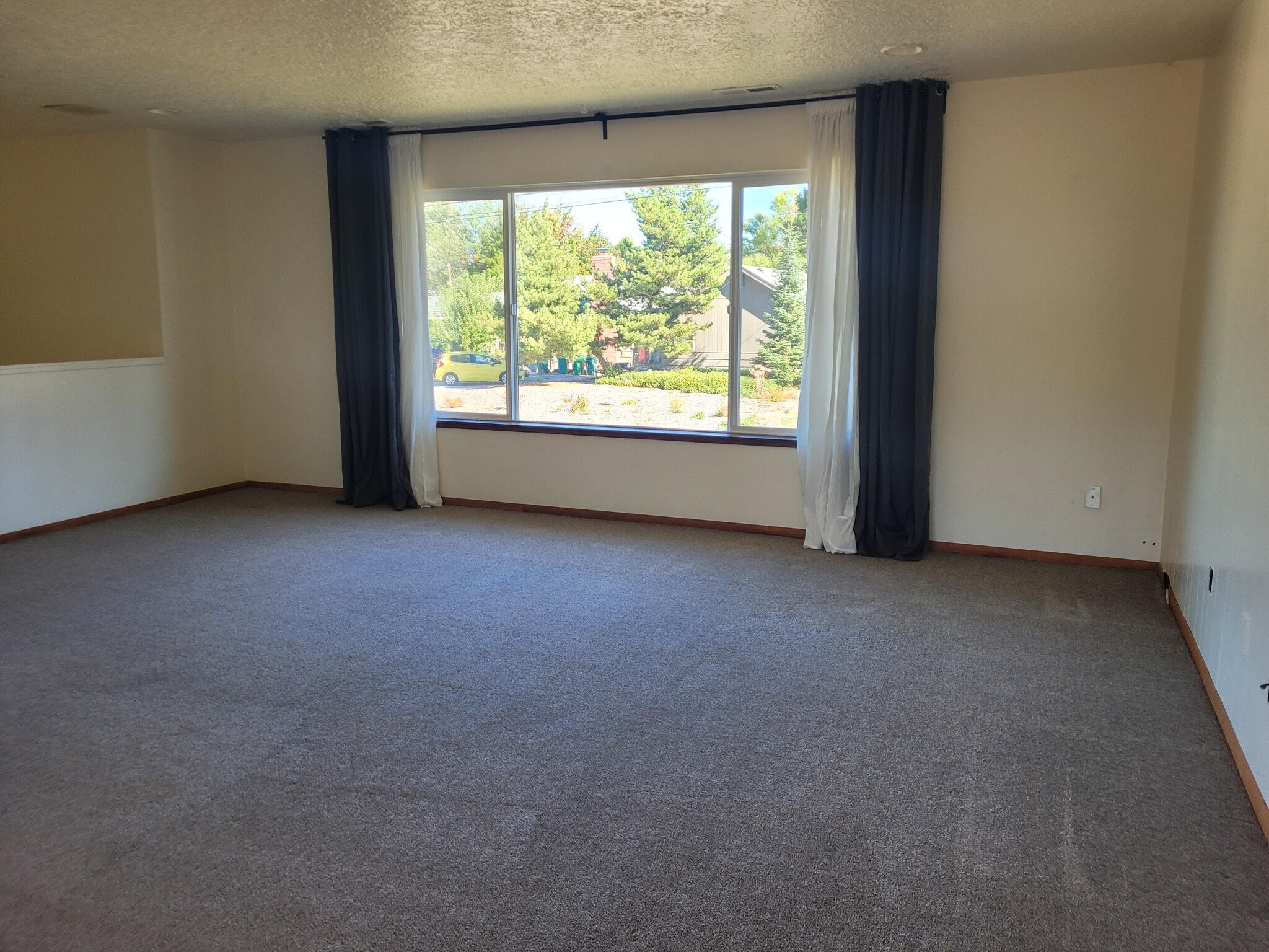 upstairs living room with big window - 5095 SW 163rd Ave
