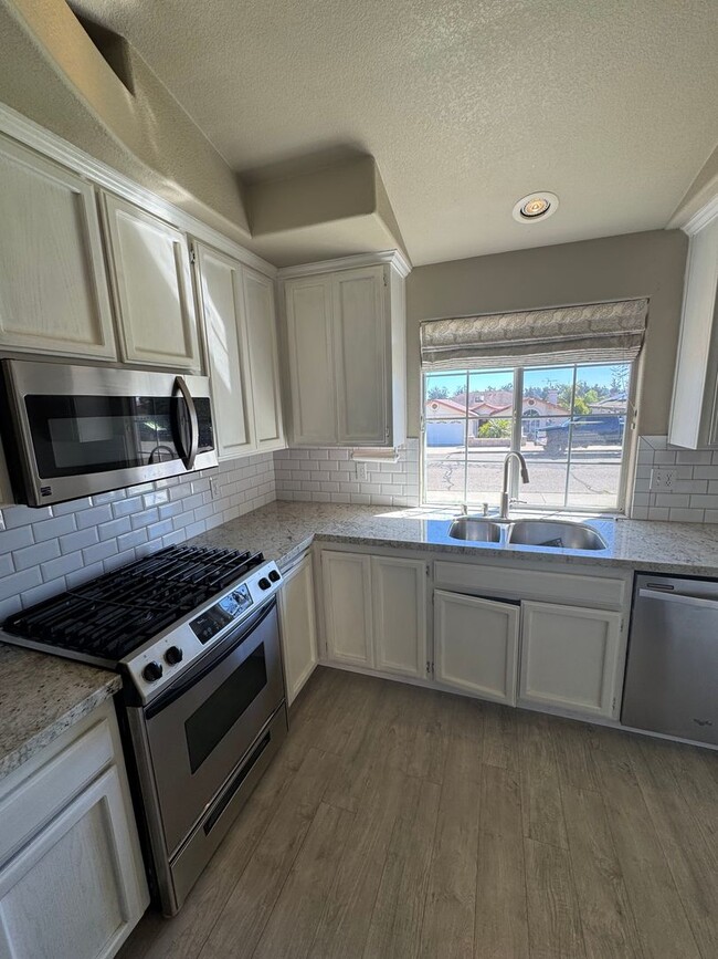 Building Photo - 4-Bedroom Home with Updated Kitchen and Co...