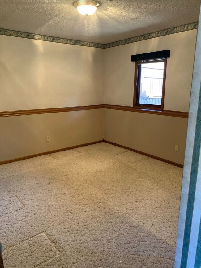 Building Photo - Elegant 4-Bedroom Split Foyer Home – West Rapid Cul-de-Sac!