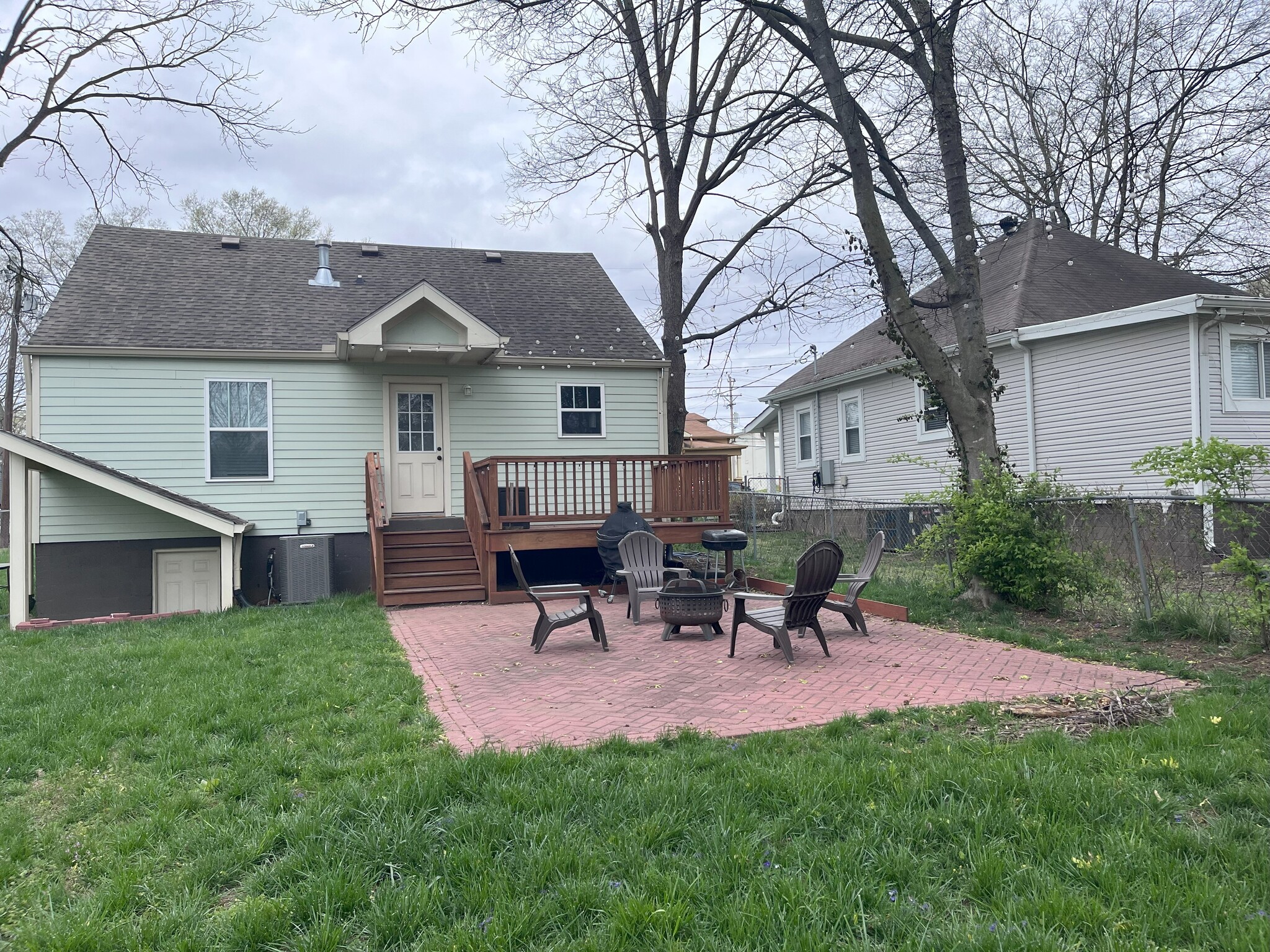Two outdoor living spaces - deck and patio are great for entertaining. Bonus: string lights! - 1115 N 2nd St