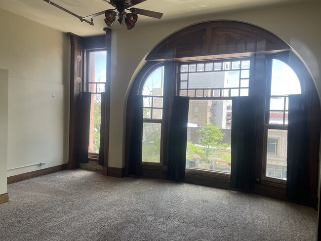 Historic Romanesque arched window circa 1891 - 208 S Washington Sq