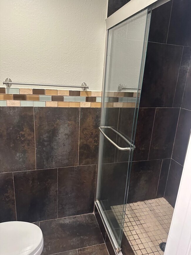 Toilet and shower for the master. - 2411 Prospect Ave