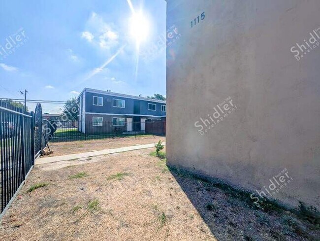 Building Photo - Upstairs 2 Bedroom 1 Bath with Massive Walk In Closet, Covered Gated Parking
