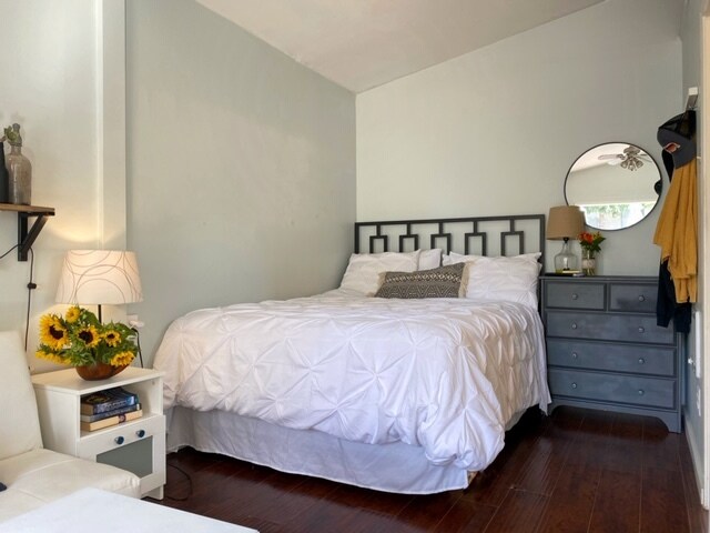The cozy queen bed is tucked away. - 9730 Regent St