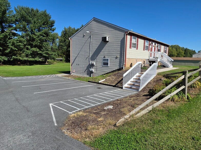 1 designated parking spot per unit with 3 visitor spots and on street parking as well. - 152 Church St