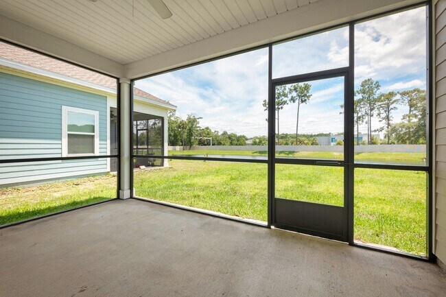 Building Photo - Spacious 4-Bedroom Home with Screened Pati...