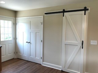 Sliding barn door offering a large pantry, coat closet, and storage area...the double door offers a convenient place for the washer and dryer - 2312-A Belle Ave NE