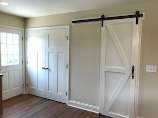 Sliding barn door offering a large pantry, coat closet, and storage area...the double door offers a convenient place for the washer and dryer - 2312 Belle Ave NE
