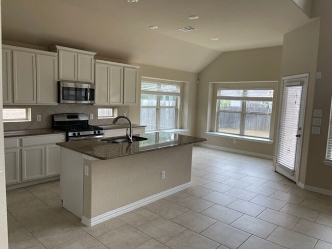 Building Photo - Move-In Ready! Stunning 1.5-Story Home wit...