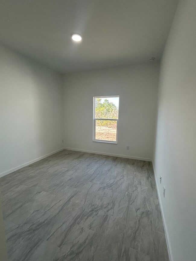 Building Photo - BRAND NEW Modern 4BR/2BA Home with Garage – Peaceful Lake Placid Retreat