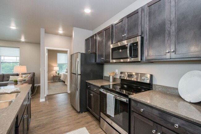 Building Photo - Spacious 1-Bedroom/1.5-Bath, End/Corner unit 201, available 8/1/26