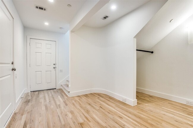 Building Photo - Beautiful townhome featuring granite countertops, hard wood floors, and a small private yard grea...