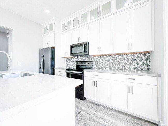 Building Photo - Lake Nona Move-In Special! Save $100/Month | 4 Bed, 3.5 Bath Laureate Park Townhome