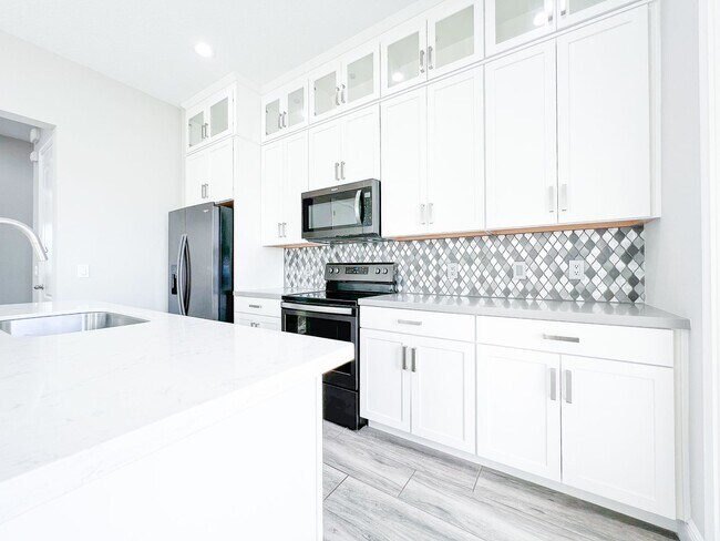 Building Photo - Luxury 4-Bedroom Townhome in Laureate Park – Now Available!