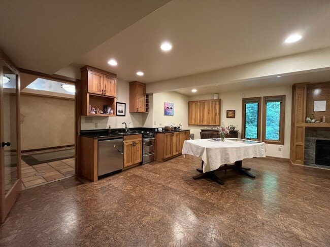 Building Photo - One-of-a-Kind Custom Home with Wall of Windows, Stone Fireplaces, Expansive Entertainment Space &...
