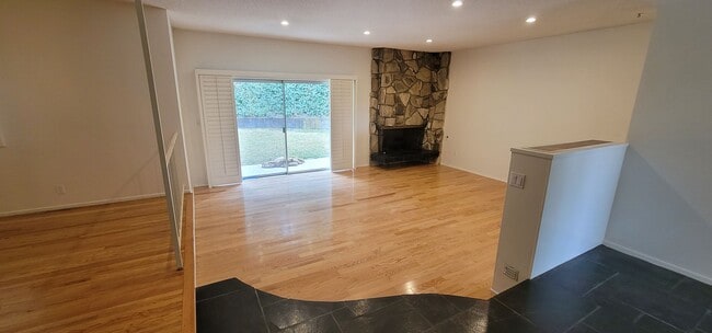 Building Photo - Classic, Midcentury 3 bedroom with Den, 2.5 bath home nestled into hillside with secluded backyar...