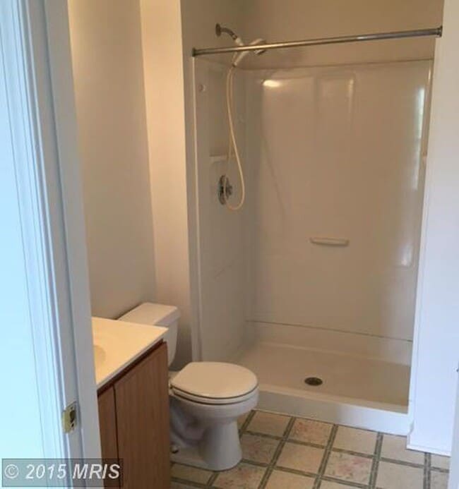Building Photo - A spacious three bedroom, two and one half...