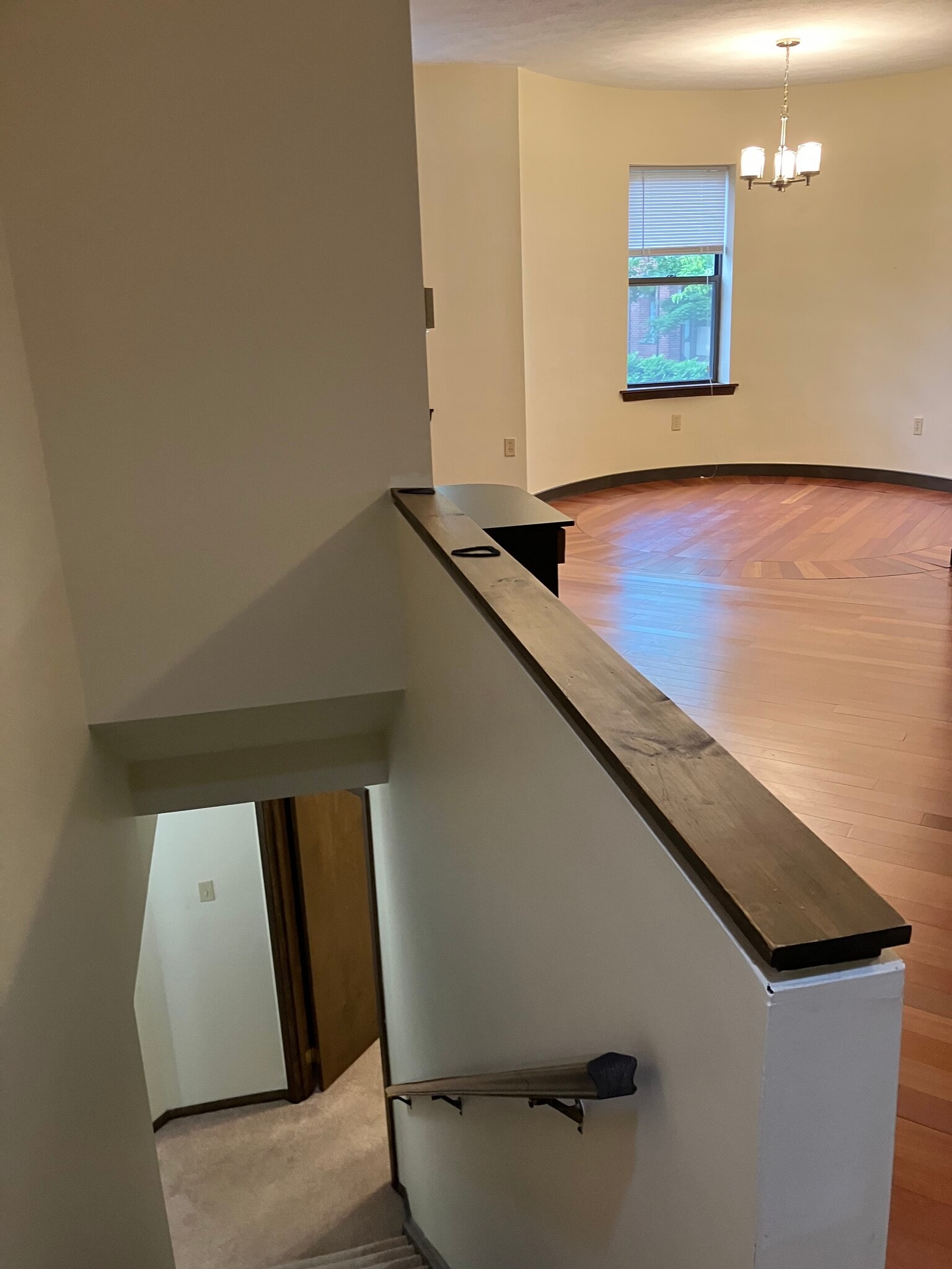 steps leading to lower level with view of living room - 6344 Aurelia St