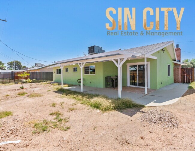 Building Photo - "Charming 4-Bedroom Retreat in Las Vegas –...