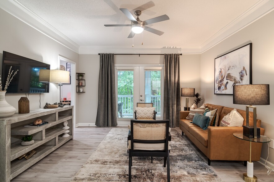 Newly Renovated Spacious Living Room - The Residences on McGinnis Ferry Apartments