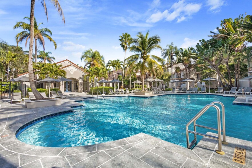 Take a refreshing swim in the pool, where plenty of sunshine creates the perfect atmosphere to unwind. - Windsor Coconut Creek