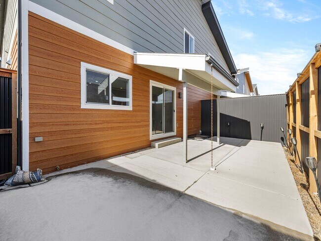 Building Photo - 4-Bedroom Townhome with Finished Basement, Garage & Private Outdoor Space