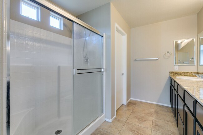 Building Photo - Spacious Townhouse with Loft & Rare 3-Car Garage!