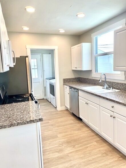 Kitchen with adjacent laundry room - 10134 Memory Park Ave